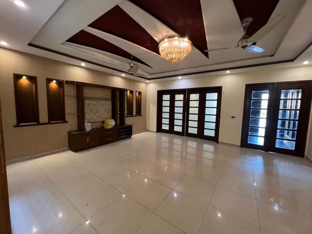 TV Lounge with Chandelier and Tile Flooring – 15 Marla House Valancia Society Lahore