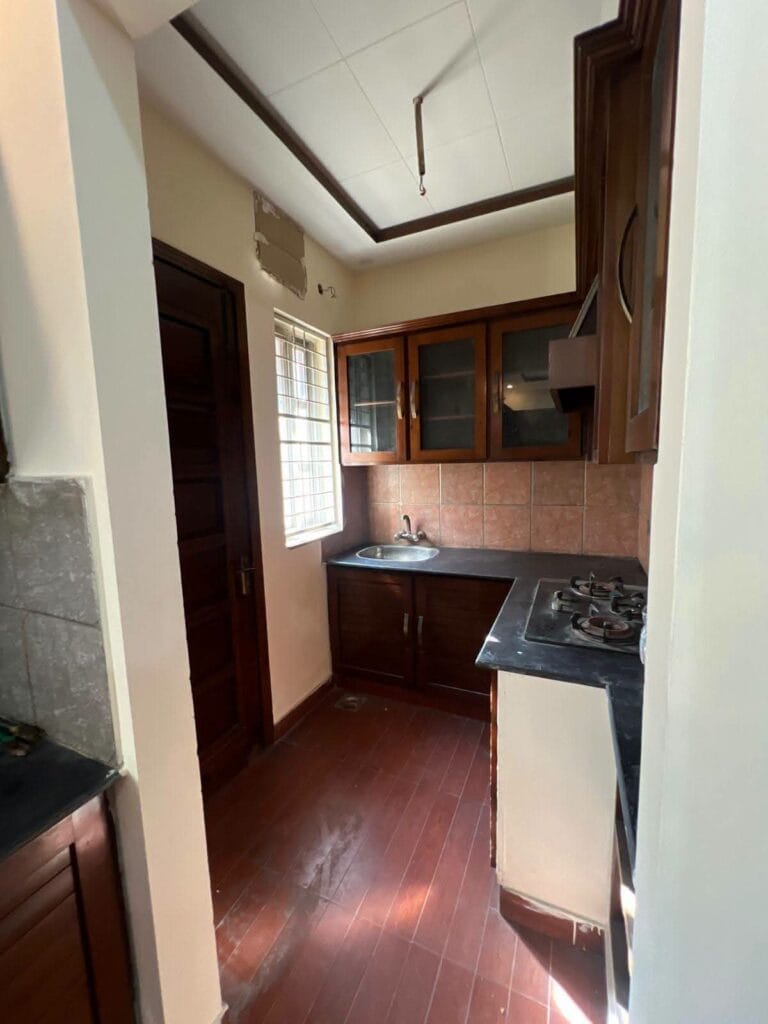 Second Kitchen with Wooden Cabinets – 15 Marla House Valancia Society Lahore