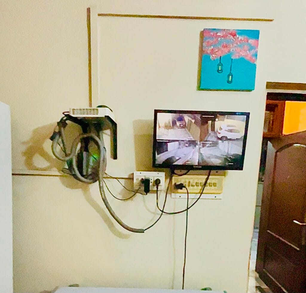 CCTV security monitor in 10 Marla triple storey house for sale in Gulberg 3, Lahore