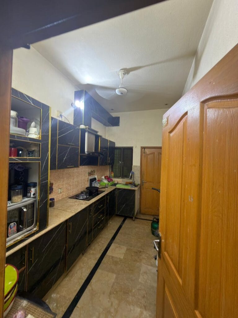 Modern Kitchen with Black Cabinets – 3.5 Marla House Johar Town Lahore