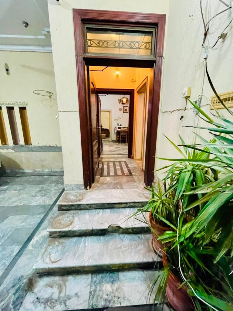 Main entrance with marble steps in 10 Marla triple storey house for sale in Gulberg 3, Lahore