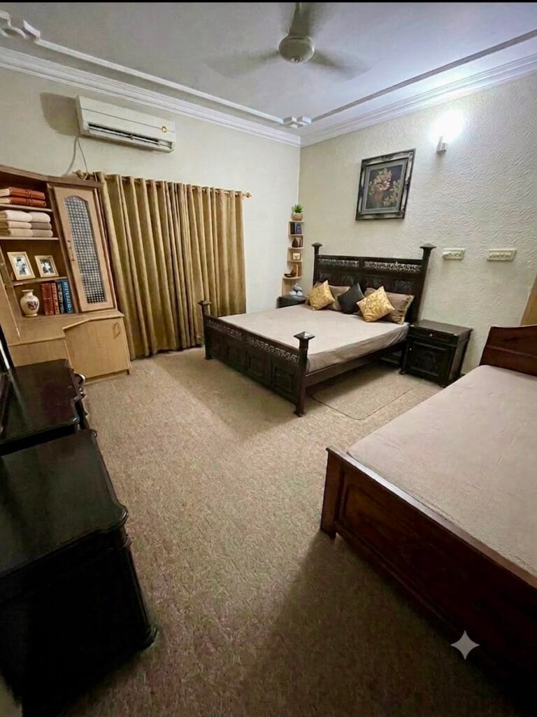 Bedroom 2 in 10 Marla triple storey house for sale in Gulberg 3, Lahore