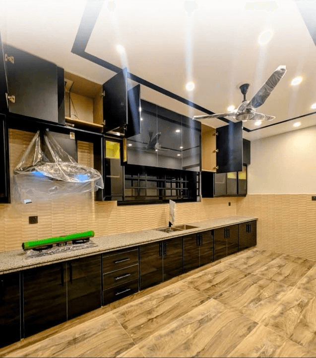 1 Kanal house for sale in IEP Town Sector A, Lahore - modern kitchen with wooden flooring