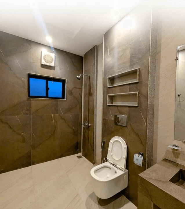 1 Kanal house for sale in IEP Town Sector A, Lahore - bathroom with marble finish and built-in shelving