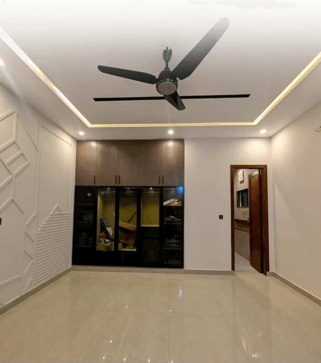1 Kanal house for sale in IEP Town Sector A, Lahore - spacious bedroom 2 with built-in wardrobes