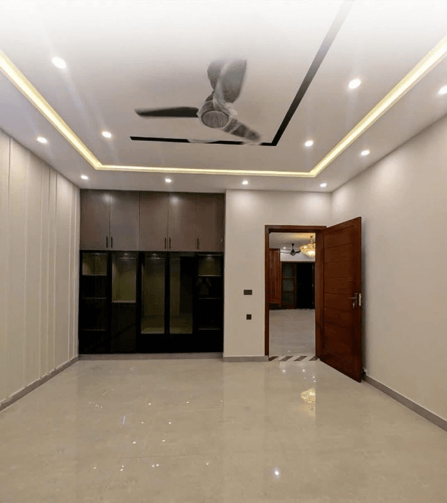 1 Kanal house for sale in IEP Town Sector A, Lahore - spacious bedroom 1 with built-in wardrobes