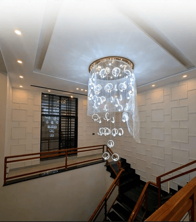 1 Kanal house for sale in IEP Town Sector A, Lahore - staircase with designer chandelier