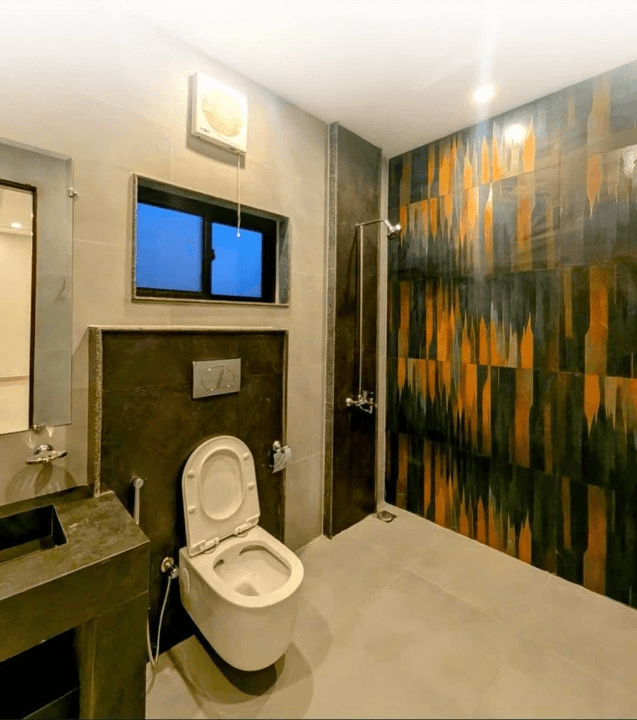 1 Kanal house for sale in IEP Town Sector A, Lahore - bathroom with mosaic accent wall