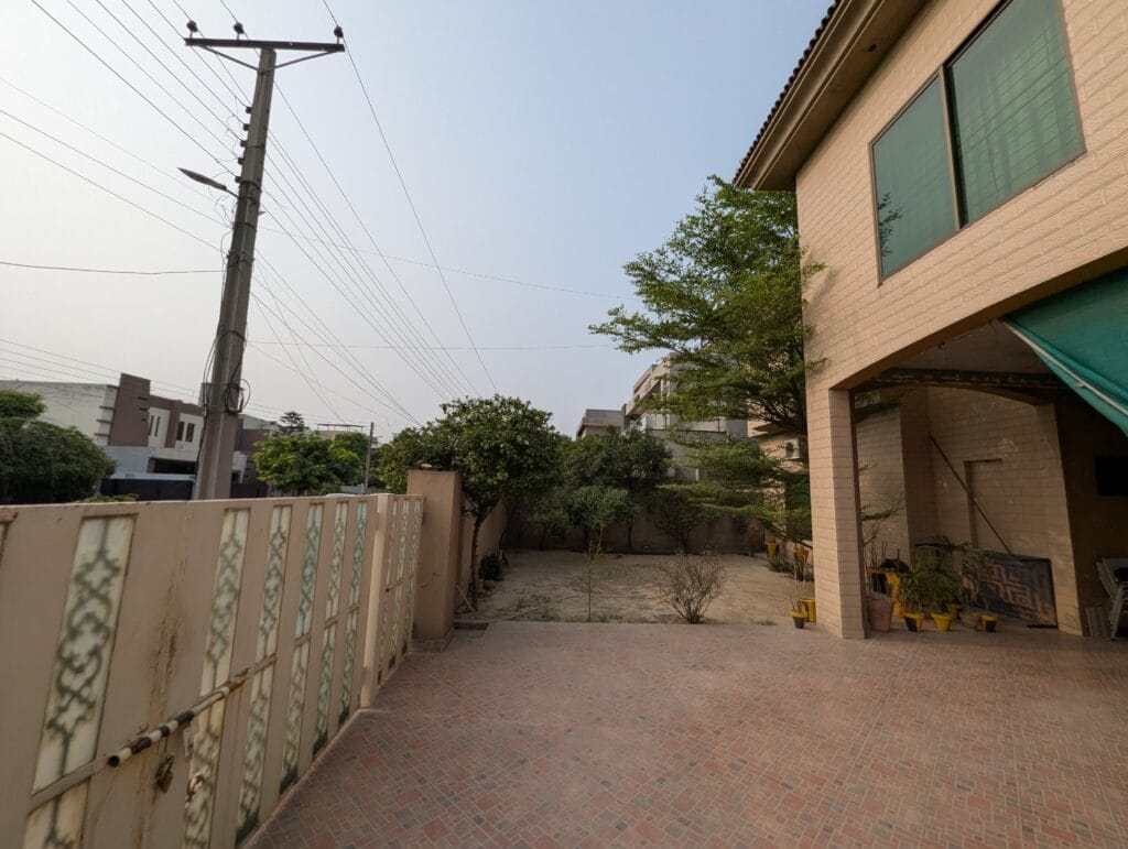1 Kanal House for Sale – Valancia Society Block C1, Lahore | Lawn and Driveway View